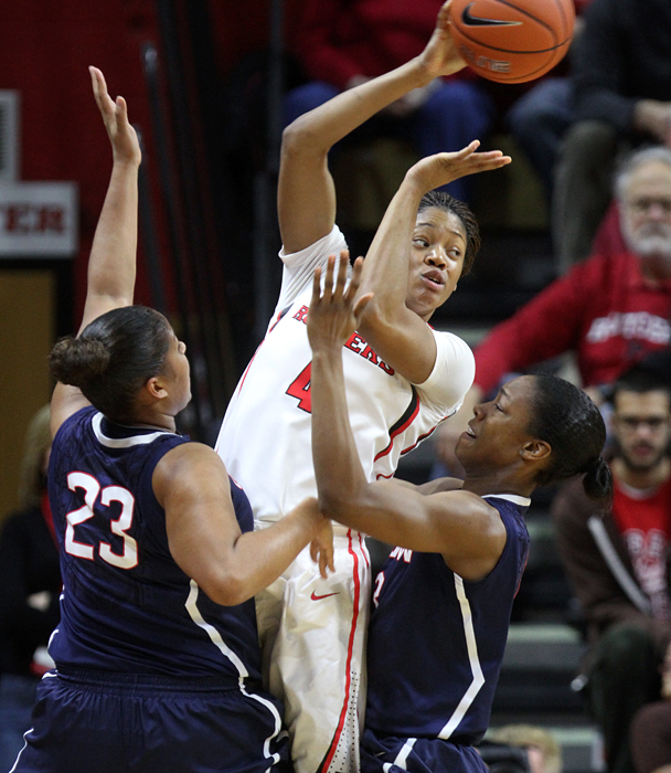 Rutgers' Briyona Canty looks to pass out of pressure from Connecticut's Kaleena Mosqueda-Lewis, 23, and Brianna Banks.