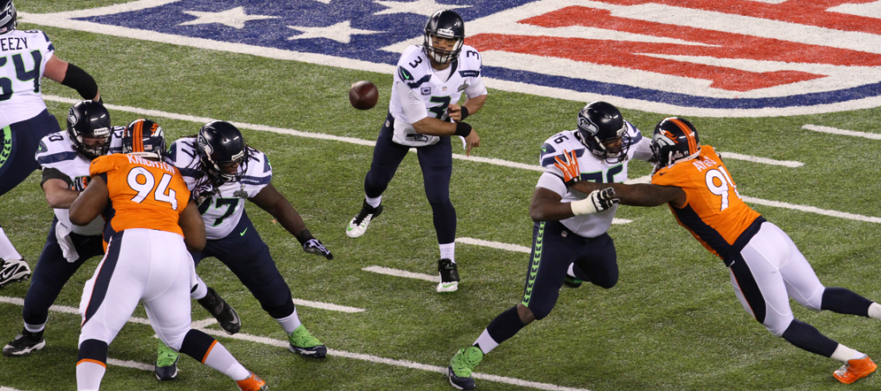 Seattle quarterback Russell Wilson passes during the first quarter against Denver in Super Bowl XLVIII.