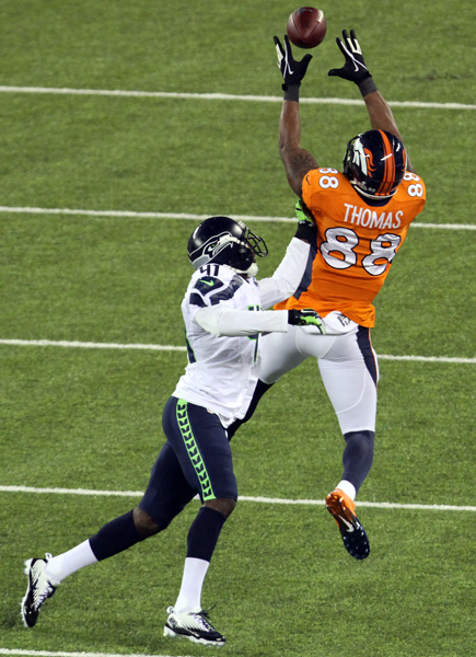 Denver's Demaryius Thomas pulls in a second quarter pass over Seattle's Byron Maxwell during Super Bowl XLVIII.